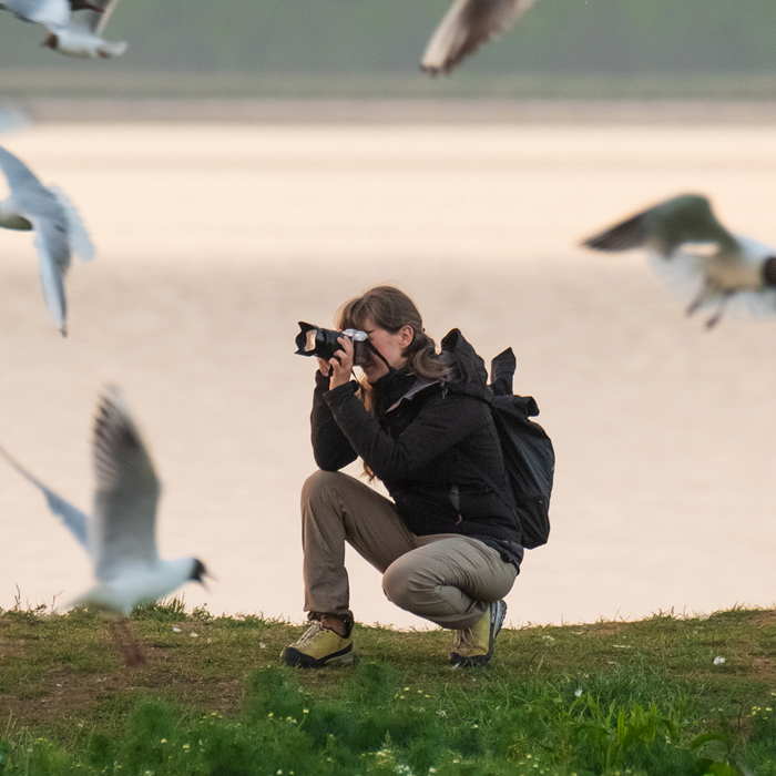 Machu women's trousers in sand, insect repellent trekking pants. Woman wearing while photographing birds