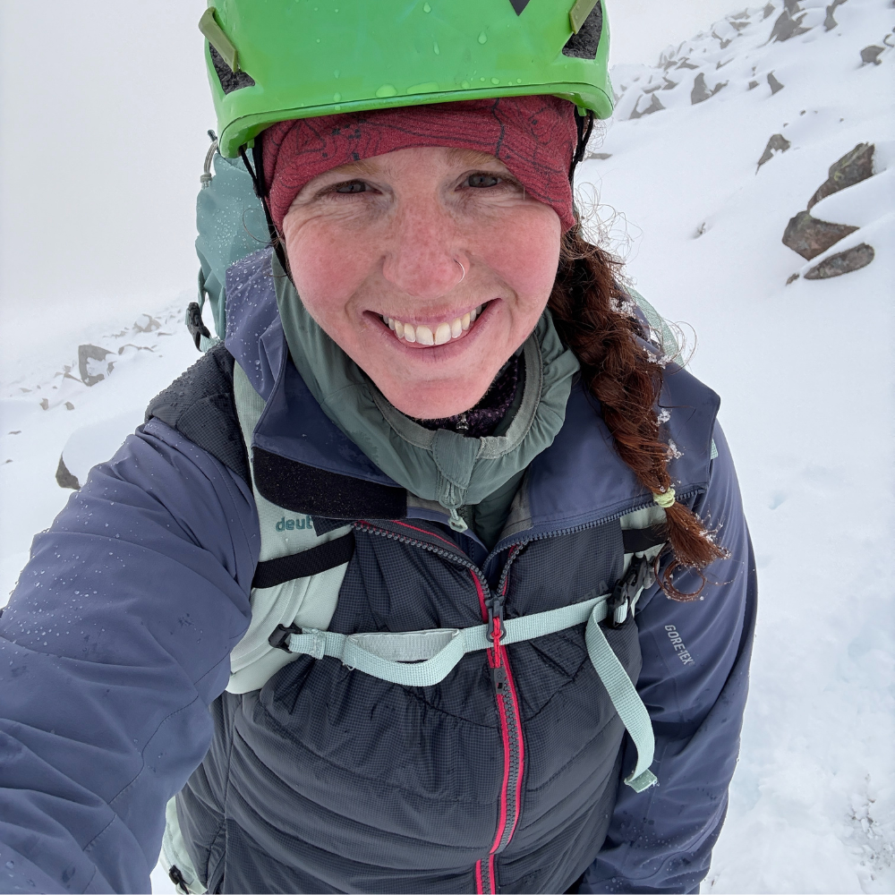 Smiling woman wearing Women's Solo insulated gilet in snow