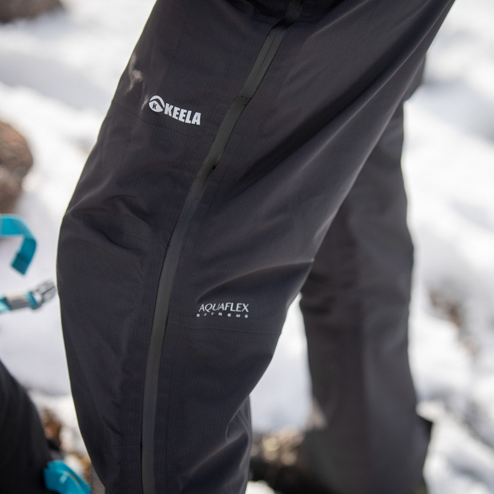 Pinnacle waterproof trousers in action - high mountain trekking showing technical performance