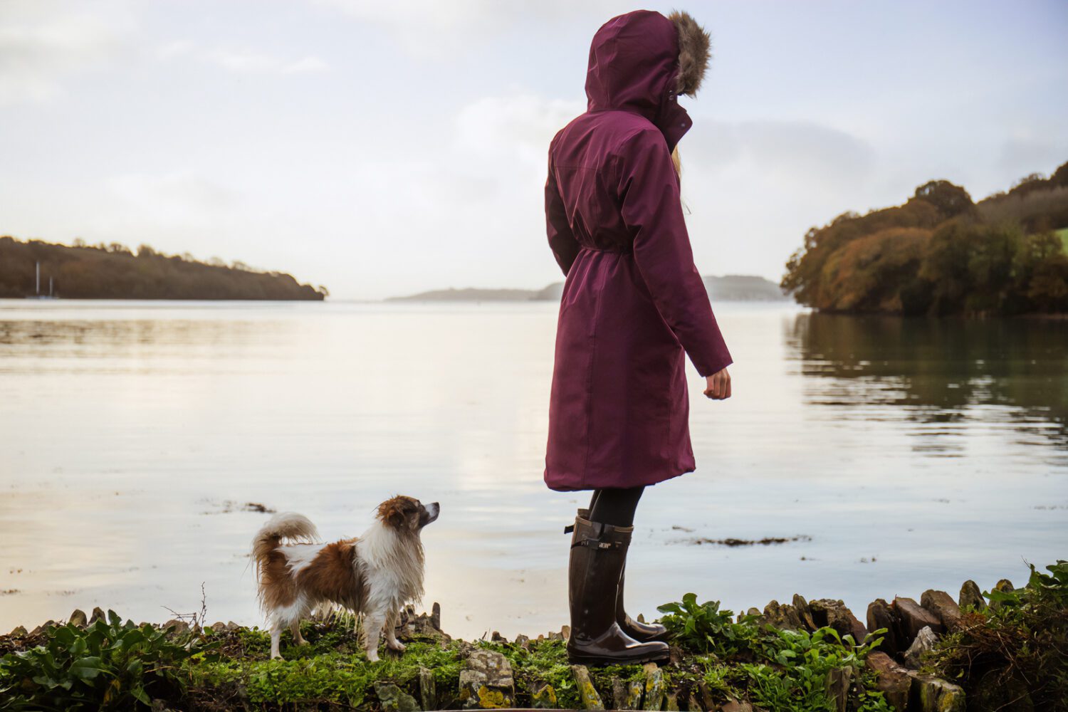 Woman wearing crofter jacket with dog